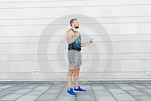 Man exercising with jump-rope outdoors