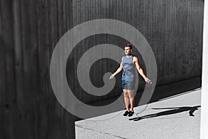 man exercising with jump-rope outdoors