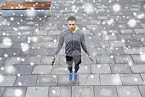 Man exercising with jump-rope outdoors