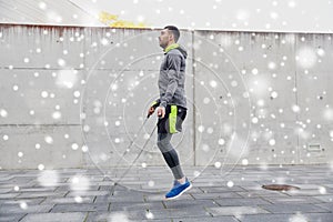 Man exercising with jump-rope outdoors