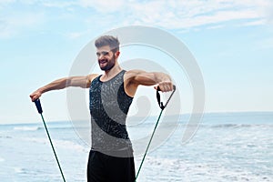 Man Exercising Outdoor, Doing Workout Exercise At Beach. Fitness