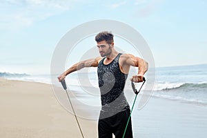 Man Exercising Outdoor, Doing Workout Exercise At Beach. Fitness