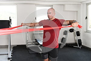Man Exercising With a Resistance Band