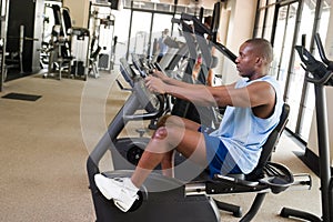 Man Exercising On Stationary Cycle