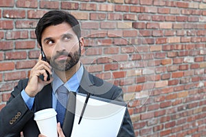 Man experimenting nervousness during phone call photo
