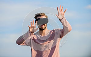 Man explore VR sky background. VR technology and future. VR communication. Exciting impressions. Gaming and