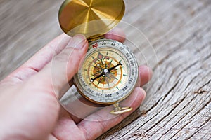 Man explorer searching direction with compass for map - Navigational compass travel and tourist concept