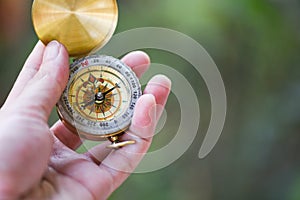 Man explorer searching direction with compass for map - Navigational compass travel and tourist concept