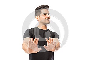 Man Expressing Denying On White Studio Background