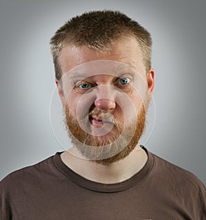 Man with an expression of discontent on his face