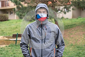 Man in face mask with flag of Czech Republic