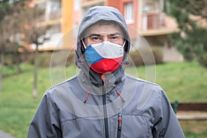 Man in face mask with flag of Czech Republic