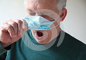 Man with face mask has trouble breathing photo