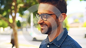 Man, face and smile outdoor in road with casual style, trendy outfit and glasses in urban town or city. Person, portrait