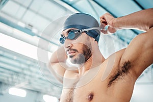 Man, face or swimmer with pool goggles, cap or gear and sports vision, power or mindset in low angle competition