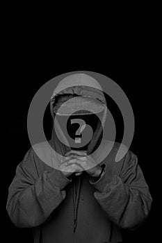 man faceless hoodie and hat  black white studio photo. concept of mystery man, criminal, robber, hacker