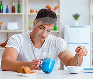 Man falling asleep during his breakfast after overtime work