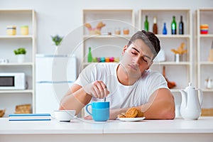 The man falling asleep during his breakfast after overtime work