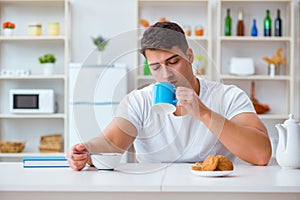 The man falling asleep during his breakfast after overtime work