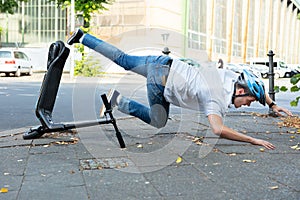 Man Falling From E-Scooter