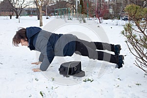 A man falls in the snow. The man slipped and was injured. Falling on ice. Winter. Fracture, bruise, dislocation