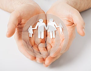 Man with family of paper men