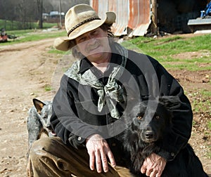 Man on farm with his dogs