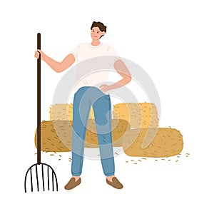 Man farmer standing with scythe during haymaking and harvesting
