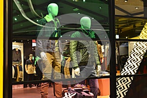 Man Fashion clothing shop window with mannequins, christmas decoration,dress store window, shop decoration