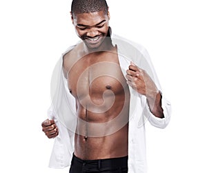 Man, fashion and muscle with abs, sexy and dressing for chest, african and male model in white background. Alone, smile