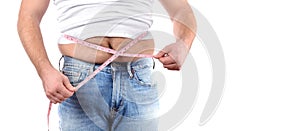 Overweight man with tape measure around waist photo