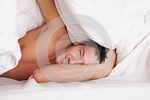 Man in feather bed - the awakening