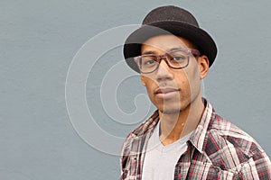 Man with Fedora hat and eye glasses
