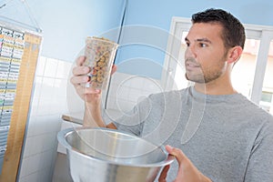 man feeding animals