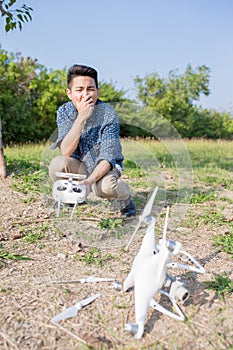 Man with crashed drone