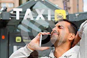Man feeling bad becouse he having a problem to order taxi from his phone