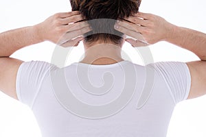 A man feeling exhausted and suffering from neck and head pain and injury on isolated white background. Health care and medical