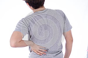 A man feeling exhausted and suffering from waist and back pain and injury on isolated white background. Health care and medical