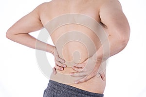 A man feeling exhausted and suffering from waist and back pain and injury on isolated white background. Health care and medical