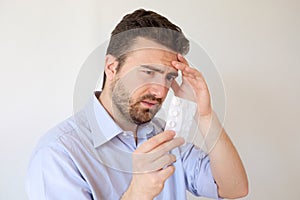 Man feeling sick looking instruction