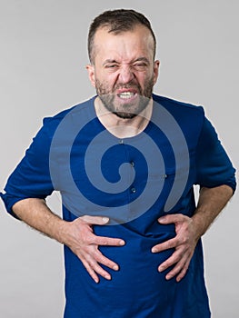 Man feeling stomach ache pain