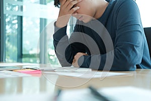 Man feeling tired, frustrated stressed from hard work. exhausted freelancer have headache