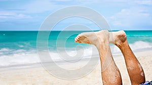 Man feet at beach