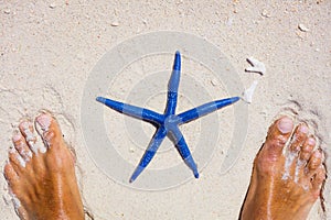 Man feet with a starfish.