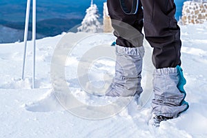 Man feet tourist protection trekking mountain snow winter sky blue equipment hiking