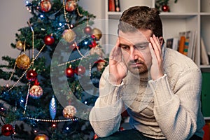 Man felling depressed and lonely during the christmas time photo
