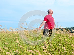 Man in field with breeze