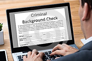 Man Filling Criminal Background Check Application Form