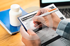 Man filling medical form for health insurance. Medicine research