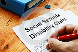 Man filling in Social Security Disability Claim